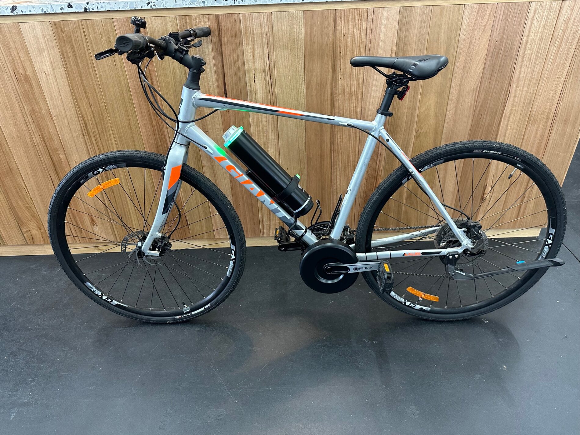 Cargocycles recently converted this Giant Cross City hybrid bike into a powerful ebike with a Pendix mid-drive motor.